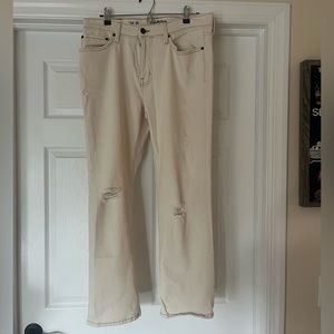Men’s white ripped denim pants; NEVER WORN